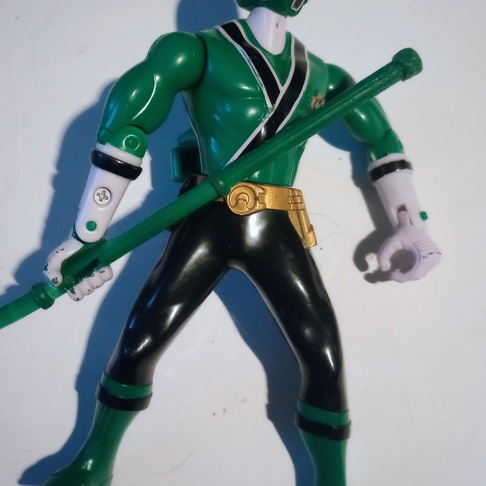 Green and Black Reptile Action Figure